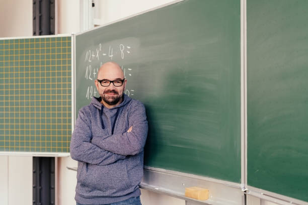 istock Portrait of a math middle-aged teacher smiling 1146608554