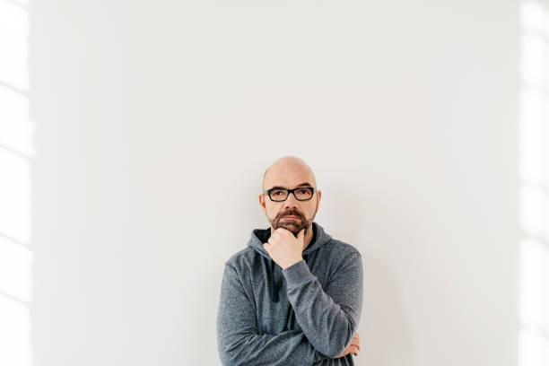 istock Undecided middle-aged man thinking of decisions 1146609121