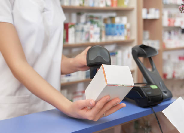 istock Scanning of medicament price with barcode scanner. 1146610241