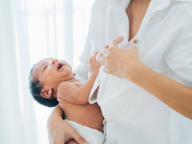 istock Asian newborn baby with mother 1146612866
