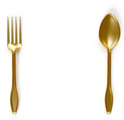 golden spoon and fork with white background