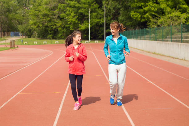 istock Mother and daughter running 1146620955