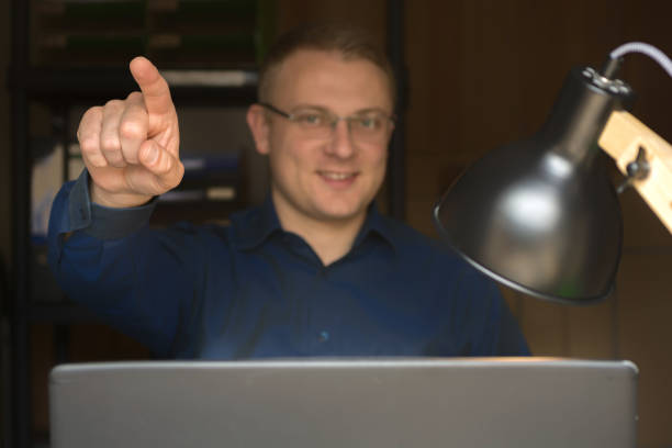 istock Man with upward pointing finger as a template for further edits 1146622421