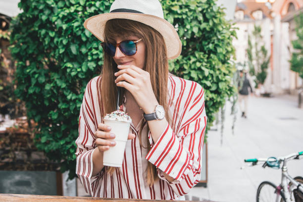 istock Young Woman drinking a Milkshake 1146629881