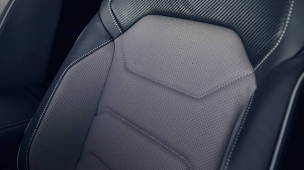 istock Leather car interior. Modern car illuminated dashboard. Luxurious car instrument cluster. Close up shot of automobile instrument panel. Modern car interior dashboard and steering wheel 1146630732