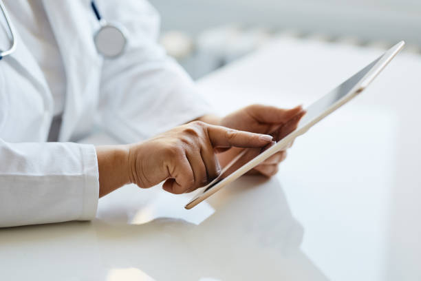 istock Female doctor presses on screen digital tablet 1146630840