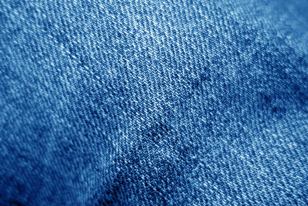 istock Jeans cloth pattern in navy blue color with blur effect. 1146632617