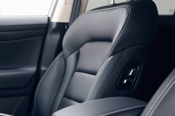 istock Leather car interior. Modern car illuminated dashboard. Luxurious car instrument cluster. Close up shot of automobile instrument panel. Modern car interior dashboard and steering wheel 1146633319