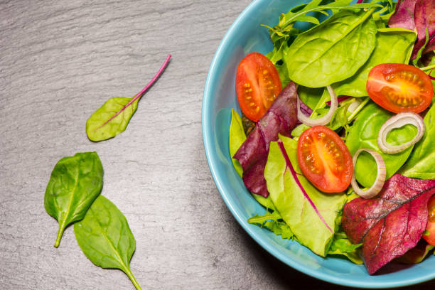 istock Leaf vegetable salad with tomato 1146634341