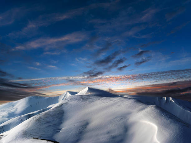 istock Day to night pastels transition in winter mountains 1146637053