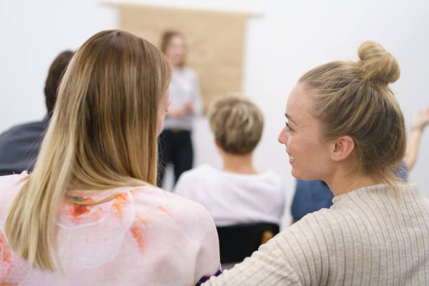 istock Two women having a discussion during a lecture 1146639786