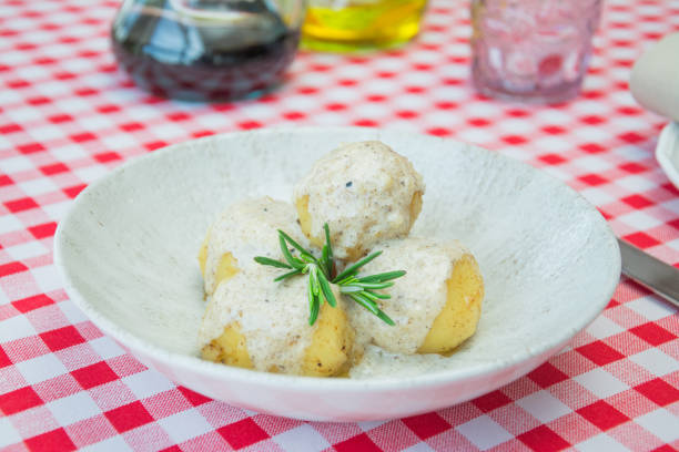 istock Potatoes with truffle sauce on plate closeup photo 1146643685