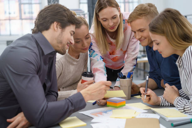istock Group of young students pooling their ideas 1146645207