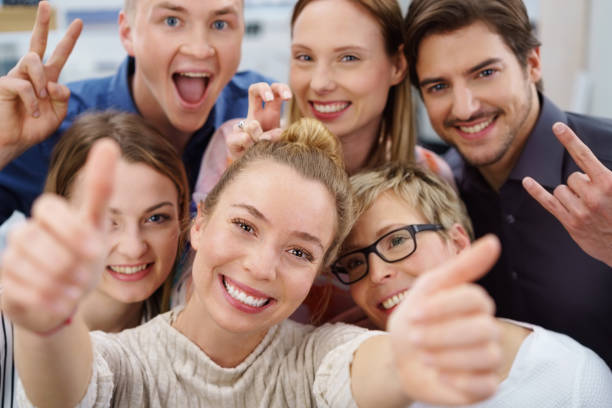 istock Funny, happy work colleagues office portrait 1146645391
