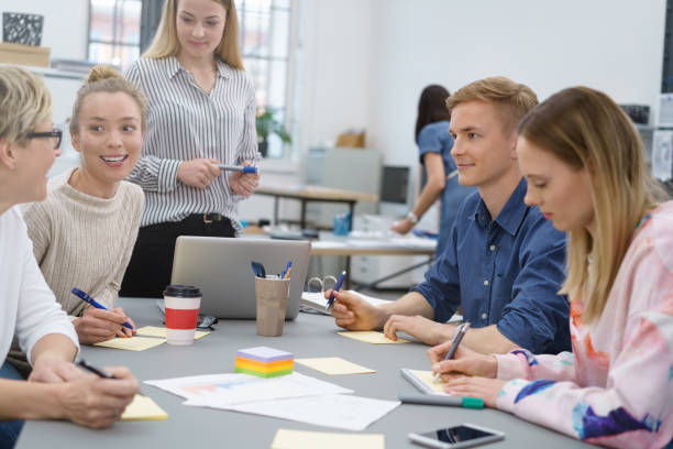 istock Group of young students or business colleagues 1146645394