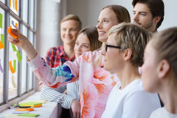 istock Happy office team meeting with sticky notes 1146646353