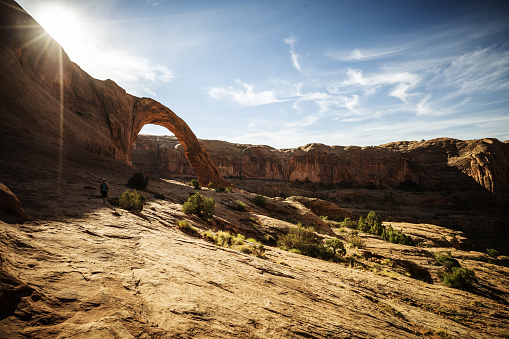 Woman hiking in Arches National Park, near Moab