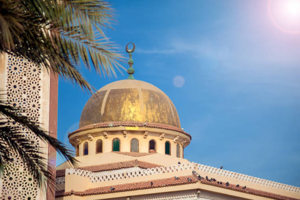 istock Beautiful white mosque in the sunlight and sky background 1146647613