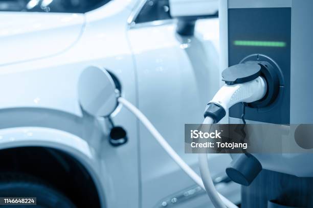 Charging An Electric Car Battery New Innovative Technology Ev Electrical Vehicle Stock Photo - Download Image Now