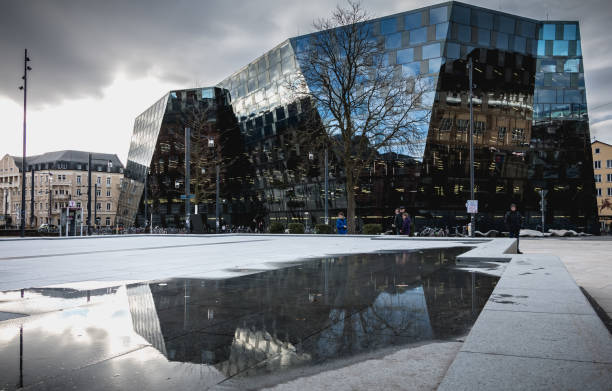 Freiburg im Breisgau, Germany - December 31, 2017: People walking in front of the modern building of the Freiburg University Library on a winter day