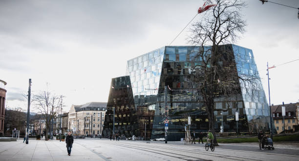 Freiburg im Breisgau, Germany - December 31, 2017: People walking in front of the modern building of the Freiburg University Library on a winter day