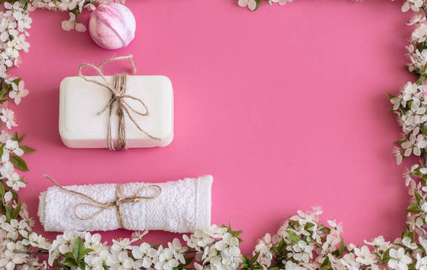 istock Spa still life on an isolated pink background with spring flowe 1146656371