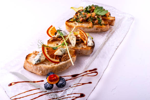 Delicious Italian antipasti bruschetta on white background. Close-up.