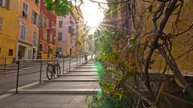 Nice, France. Gimbal sunrise shot of street  with color houses in old town of Nice, France. 4K