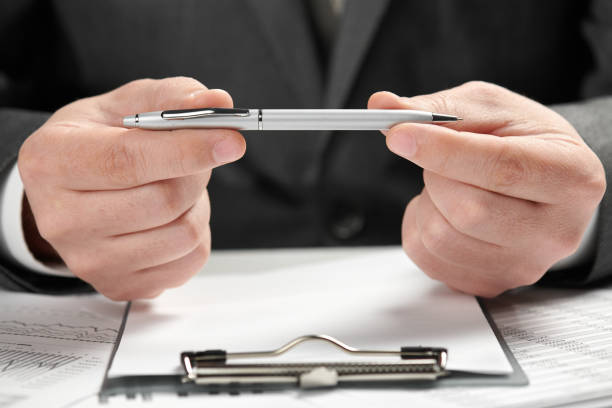 istock Businessman working in an office. Hands and documents closeup. 1146661720