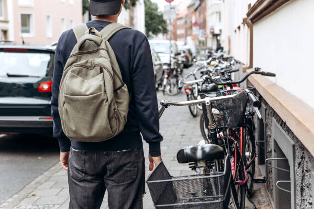 istock Tourist with a backpack is looking for booked online accommodation in an unfamiliar city. 1146667654