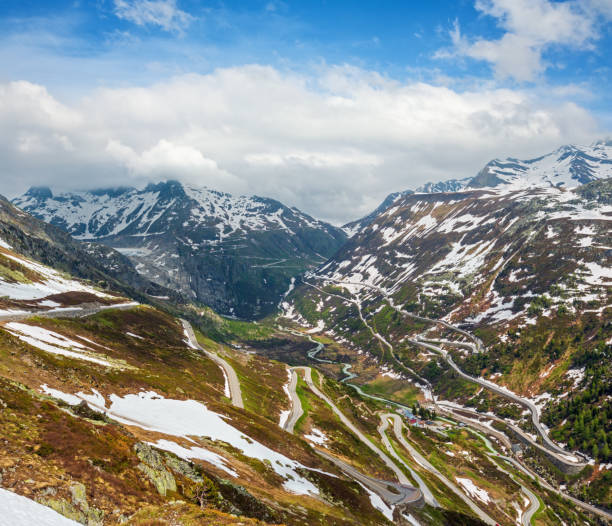 Alpine mountain road, Grimsel Pass, Switzerland Summer mountain landscape with serpentine alpine roads, Grimsel Pass, Switzerland. grimsel pass photos stock pictures, royalty-free photos & images
