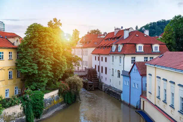 Historic water mill in Prague, water mill, Czech Republic. Old water mill at center of the Prague. Czechia. Mill Wheel of Velkoprevorsky Mill on Chertovka River in Prague, Czech Republic