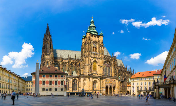 prague, bell gothic towers and st. vitus cathedral. st. vitus is a roman catholic cathedral in prague, czech republic. panoramic view from the courtyard to the south facade. prague, czechia. - architecture blue bohemia built structure imagens e fotografias de stock