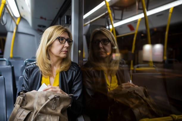 istock Mature woman in public transportation 1146671322