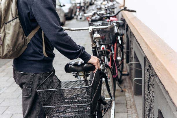 istock Tourist or student with a backpack is going to ride a bike 1146672688