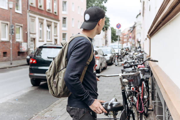 Little boy riding a bike in an alley