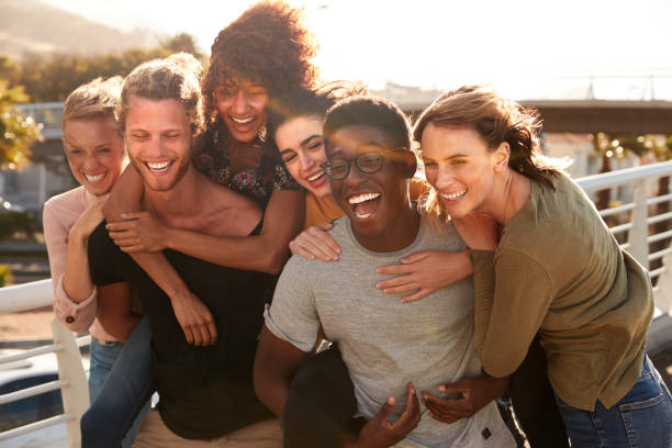 istock Smiling Young Friends Walking Outdoors Together 1146674484