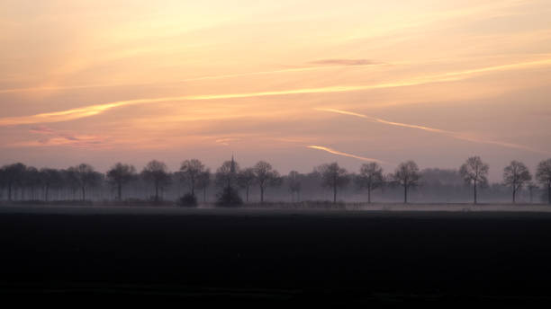 Dutch landscape during sunrise stock photo