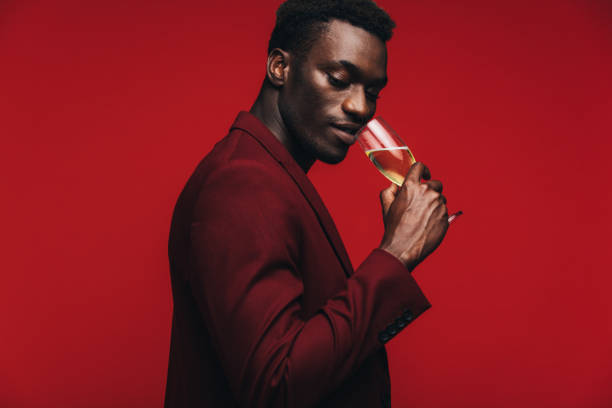 istock Sophisticated man having champagne at party 1146678517