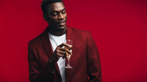 istock Stylish african man with champagne 1146678561