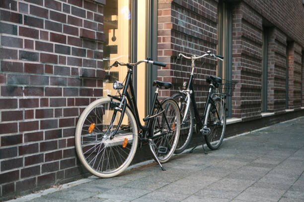 istock Bicycles are parked next to a brick wall 1146678652