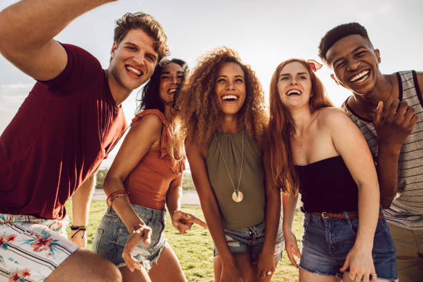 istock Happy young people dancing outdoors 1146678993