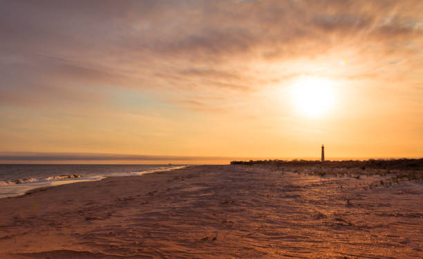 istock Cape May NJ lighthouse at sunset in early spring Atlantic Ocean with warm soft light 1146679042