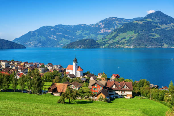 Traditional village on Lake Lucerne in swiss Alps, Switzerland Beckenried, traditional little town on Lake Lucerne in swiss Alps, Switzerland lucerne switzerland stock pictures, royalty-free photos & images