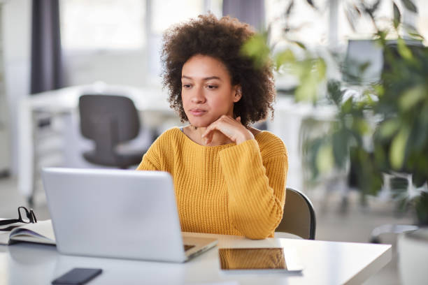 istock Businesswoman using laptop in office. 1146686866