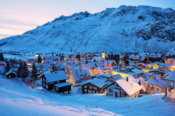 andermatt village in swiss alps mountains, switzerland in winter - ski resort winter snow night imagens e fotografias de stock