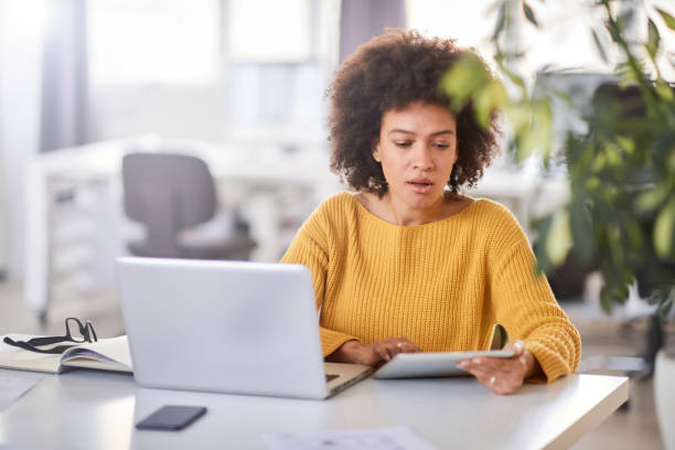 istock Businesswoman using tablet in office. 1146687025