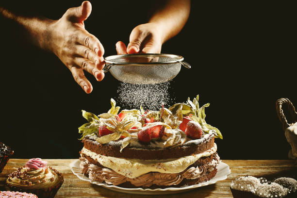 istock Chocolate cake with strawberries or chocolate pie with strawberries with hand playing sugar 1146693062