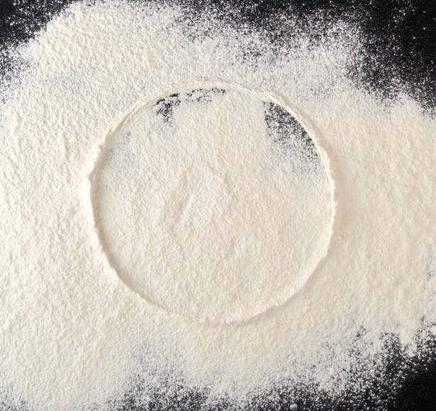 istock sprinkled white flour, round imprint from sieve 1146694263