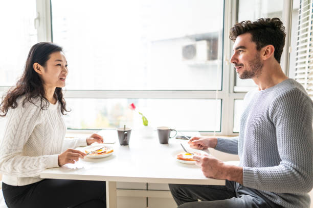 istock Couple having breakfast in their apartment 1146695911